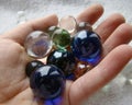 Colorful marbles in hand