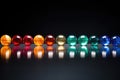 colorful marbles in a line with equality imprinted on each one Royalty Free Stock Photo