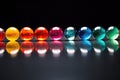 colorful marbles in a line with equality imprinted on each one Royalty Free Stock Photo