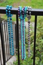 Colorful Mardi Gras Beads Hang from Porch Railing Royalty Free Stock Photo