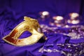 Colorful Mardi Gras or Carnival masks group on a purple background.