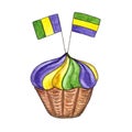 Colorful Mardi Gras cupcake decorated with yellow, green and violet topping and threecolored holiday flags. Royalty Free Stock Photo