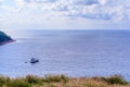 Colorful marine landscape with sail boat against deep blue sea Royalty Free Stock Photo