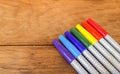 Colorful Marker Pens in Rainbow Order on Wooden Table Royalty Free Stock Photo