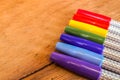 Colorful Marker Pens in Rainbow Order on Wooden Table