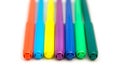 Colorful markers lying in a row on a white background. Isolated. Selective focus. Art and education