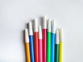 colorful markers with white caps on a white background Royalty Free Stock Photo
