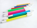colorful markers with white caps on a white background Royalty Free Stock Photo