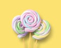 Colorful marshmallows in form of spiral on the sticks Royalty Free Stock Photo
