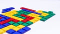 Colorful matching blocks like tetris on white background, high contrast colours, red blue yellow and green transparent tiles Royalty Free Stock Photo