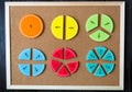 Colorful math fractions and apples as a sample on brown wooden background or table. interesting math for kids. Education Royalty Free Stock Photo