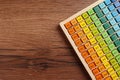 Colorful math game kit with arithmetical tasks on wooden table, top view. Space for text Royalty Free Stock Photo