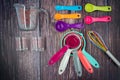 Colorful measuring cups, measuring spoons and whisk use in cooking lay on tabletop Royalty Free Stock Photo