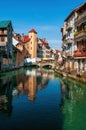 Colorful medieval houses reflected in water of the canal in Annecy, France Royalty Free Stock Photo