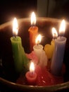 Colorful melted tapir candles in a bowl ritual or relaxation meditation style