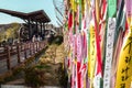 Colorful memorial ribbons by the rusty Korean war train remnant in the Imjingak Pavillion in DMZ close to Seoul
