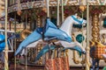 Colorful merry-go-round with animal figures. Empty vintage carousel in park. Retro roundabout. Fairground carousel. Childhood. Royalty Free Stock Photo