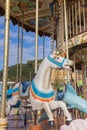 Colorful merry go round with horse figure. Empty vintage carousel in park. Retro roundabout. Fairground carousel. Childhood. Royalty Free Stock Photo