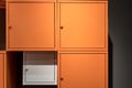 Colorful metal cabinets hanging on black wall Royalty Free Stock Photo