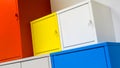 Colorful metal cabinets hanging on white wall Royalty Free Stock Photo