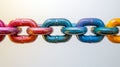 Colorful metal chain links symbolizing unity and diversity. Royalty Free Stock Photo