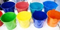 Colorful metal galvanized buckets in store