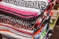 Colorful Mexican serapes hang in row. Royalty Free Stock Photo
