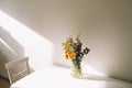 Colorful midsummer bunch of wildflowers. Bouquet of wild natural flowers in a vase on the table, selective focus. Royalty Free Stock Photo