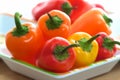 Colorful mini sweet peppers on serving tray