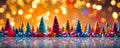 Colorful miniature Christmas trees with shiny baubles in front of a glowing light backdrop