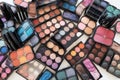 colorful mix of eye shadows, blushes, and lipsticks