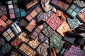 colorful mix of eye shadows, blushes, and lipsticks