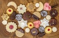 Colorful mix of homemade christmas cookies on a wooden board Royalty Free Stock Photo