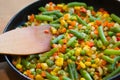 Colorful mix of vegetables is fried in a frying pan close up Royalty Free Stock Photo