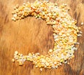 Colorful mixed cereals and legumes: rice, peas, lentils and pearl barley on a wooden background. View from above. Empty space for Royalty Free Stock Photo