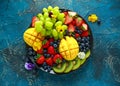 Colorful Mixed Fruit platter with Mango, Strawberry, Blueberry, Kiwi and Green Grape. Healthy food Royalty Free Stock Photo