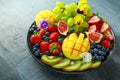 Colorful Mixed Fruit platter with Mango, Strawberry, Blueberry, Kiwi and Green Grape. Healthy food Royalty Free Stock Photo