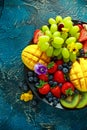 Colorful Mixed Fruit platter with Mango, Strawberry, Blueberry, Kiwi and Green Grape. Healthy food Royalty Free Stock Photo