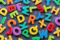 Colorful mixed letters pile on a granite table