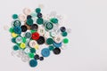 Colorful mixed sewing buttons on white background, flat lay Royalty Free Stock Photo