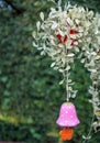 Colorful mobile flower shapes made of ceramic hanging in garden