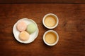 Colorful mochi rice cake on white plate and two porcelain cups w Royalty Free Stock Photo