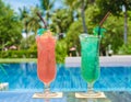 colorful mocktail at a pool bar, orange and green cocktail by the pool Royalty Free Stock Photo