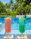 colorful mocktail at a pool bar, orange and green cocktail by the pool Royalty Free Stock Photo