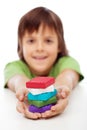 Colorful modelling clay blocks in boy hands