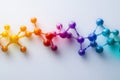 Colorful molecular structure model with gradient hues on a clean white background. Royalty Free Stock Photo