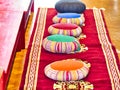 Colorful monk`s prayer or meditation cushions in the temple