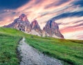 Colorful morning view from Sella pass of Sassolungo and Sella mountain range. Fantastic summer sunrise scene of Gardena valley, Royalty Free Stock Photo