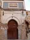 Colorful Moroccan entrance door with hand crafted stucco.