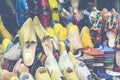 Colorful Moroccan shoes alignment in a shop. Oriental shoes in a